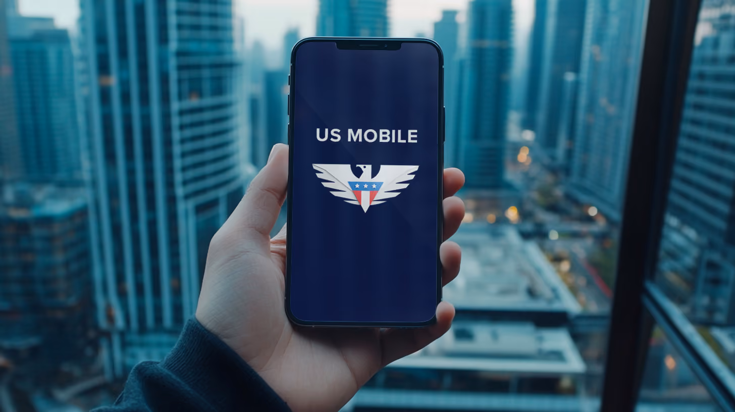 A person holding iphone with US Mobile Wireless logo on the screen
