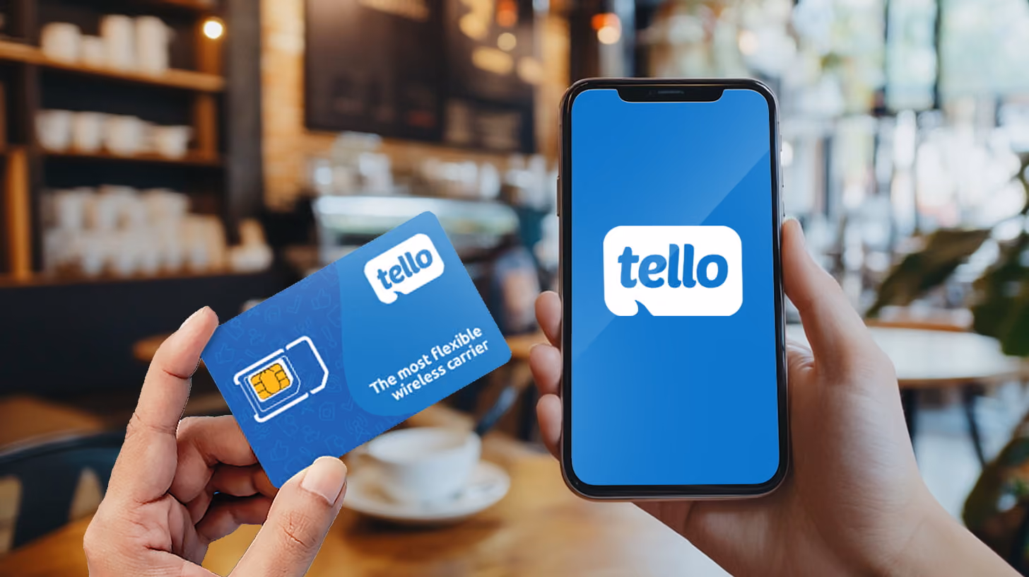 Hand holding phone and sim card with tello mobile logo on the screen