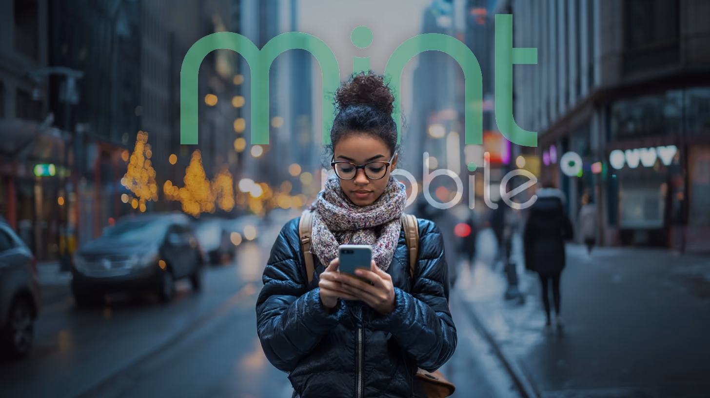 A young woman with glasses focuses on her phone, appearing engaged with the content displayed, in the midtown