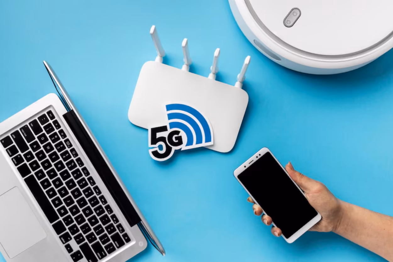 top-view-wi-fi-router-with-laptop-vacuum-cleaner
