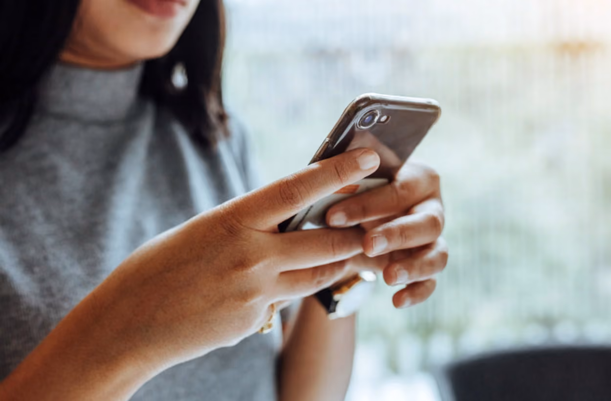 A woman holding phone