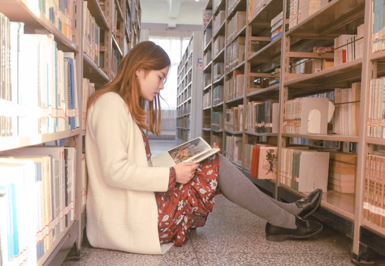 photo-of-a-woman-reading-book
