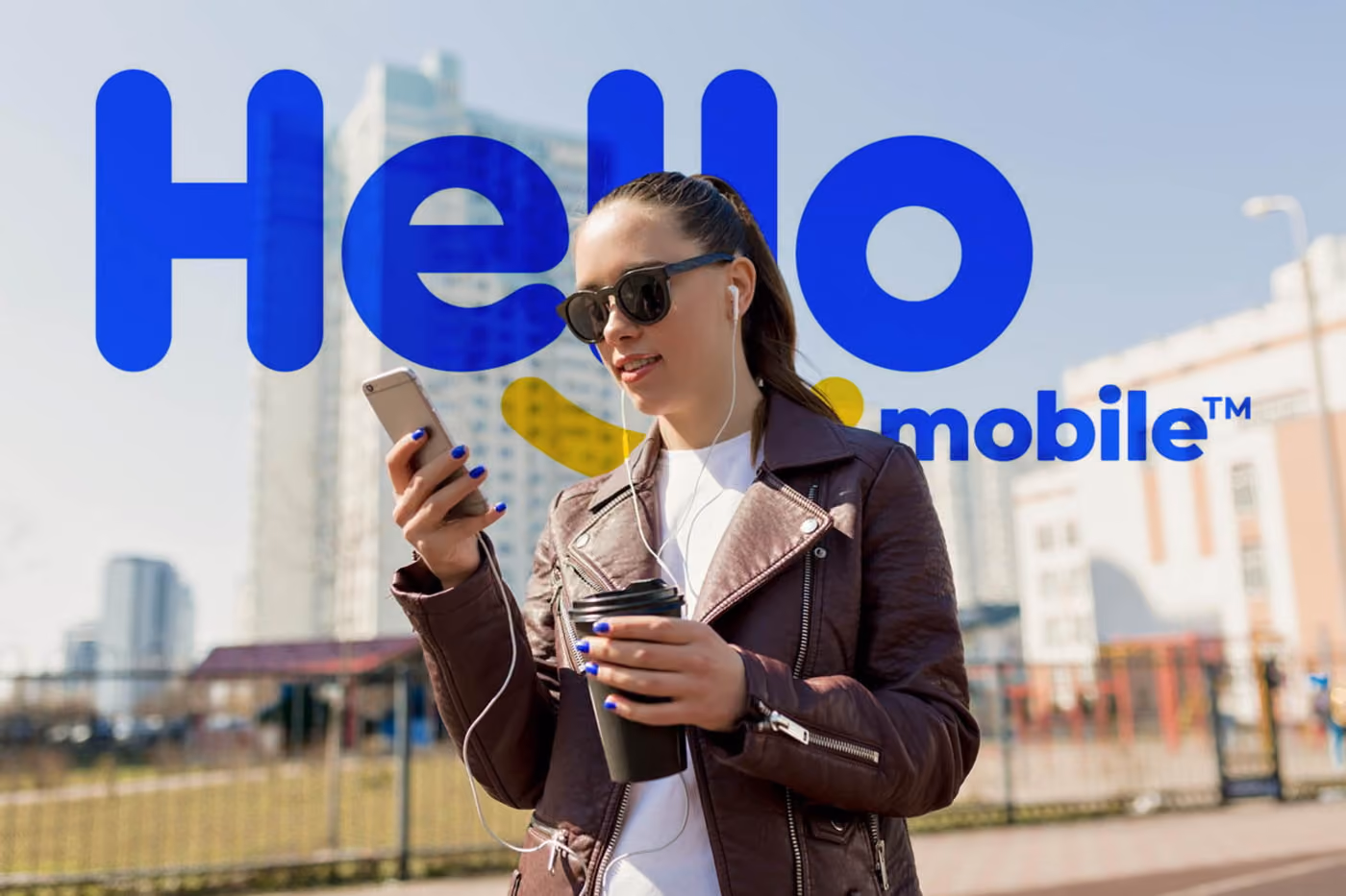 Young woman walking and watchin on her smartphone with Consumer Cellular logo on the screen