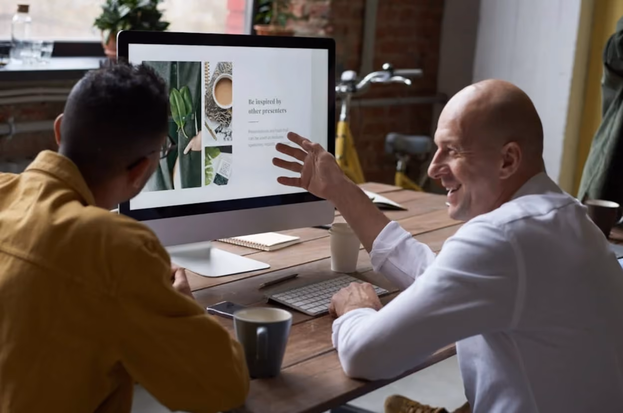 photo-of-people-sitting-in-front-of-computer