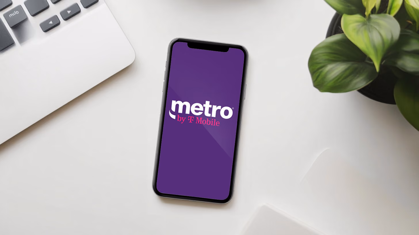 A smartphone on the desk with metro mobile logo on the screen