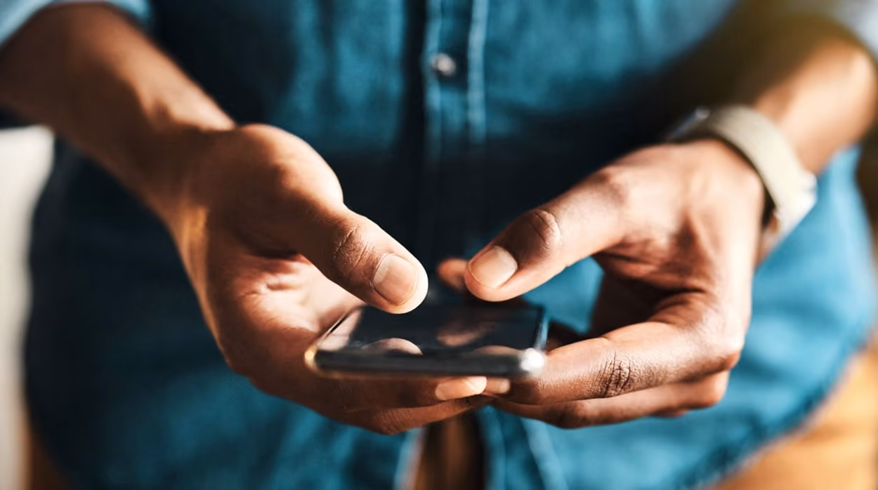 A person holding his phone