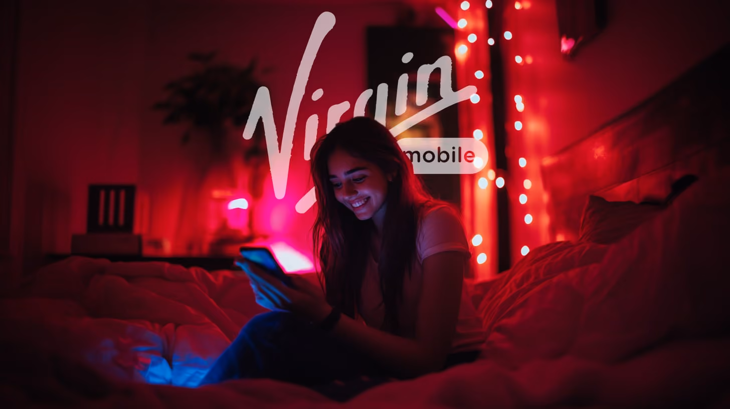 A happy young woman focuses on his phone, appearing engaged with the content displayed, in their room, red vibes