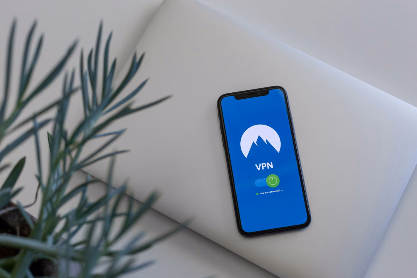 Step-by-step guide on using a VPN on an iPhone, featuring settings and connection instructions.