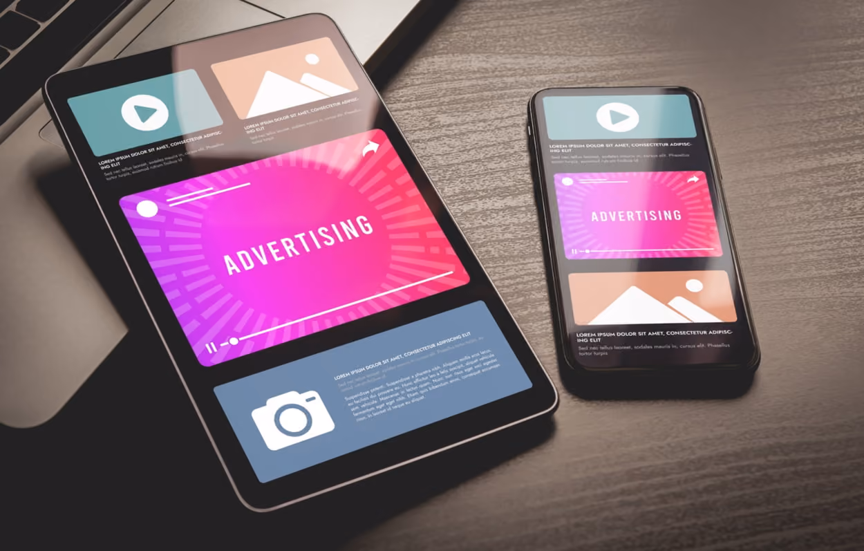 Mobile advertising concept displayed on a smartphone and tablet, showcasing digital ads and marketing strategies.