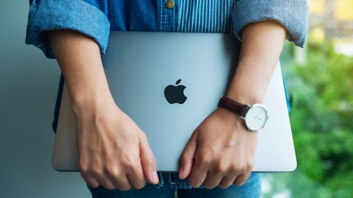 Woman Holding macbook