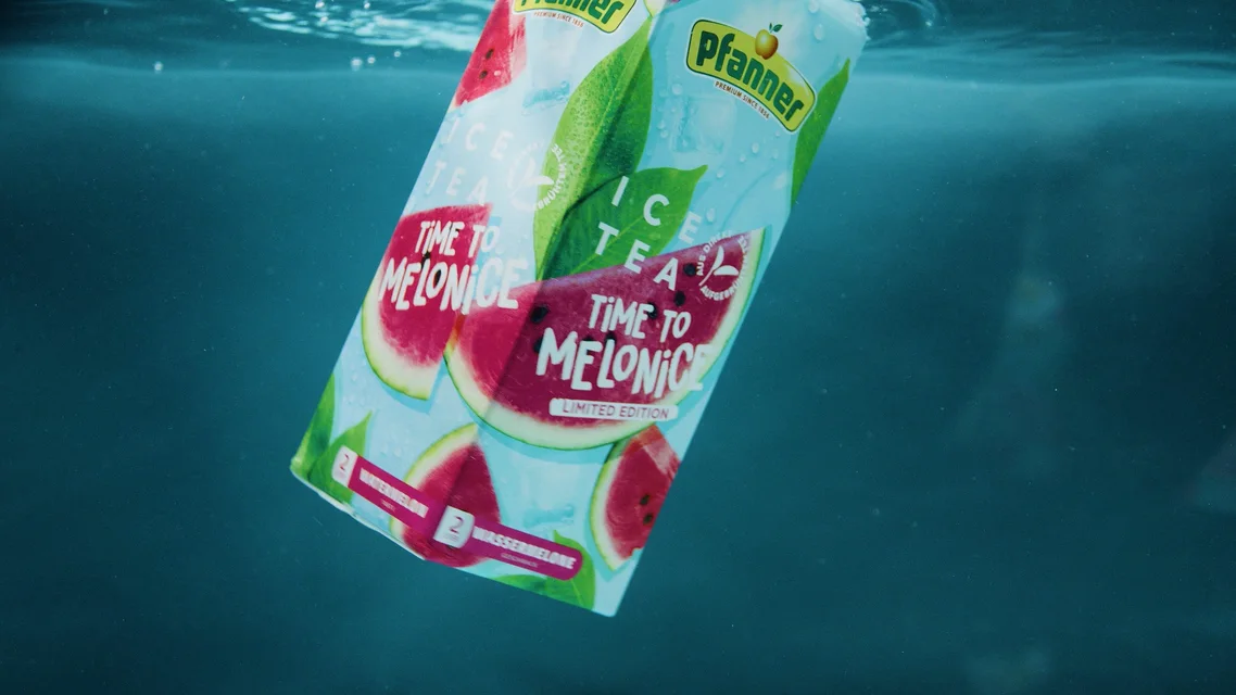 Pfanner Time to Melonice limited edition ice tea carton floating underwater with watermelon slices on the packaging.