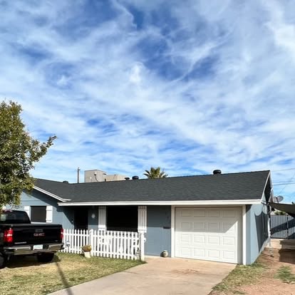 Completed new dark shingle roof installed on a Phoenix Arizona home
