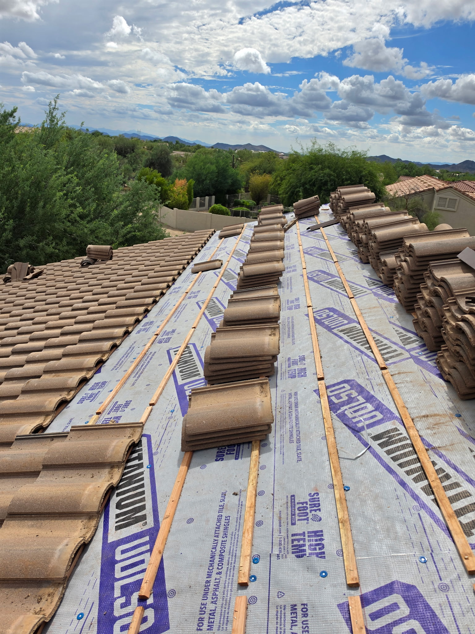 Dry-in progressing across the tile roof in Phoenix Arizona