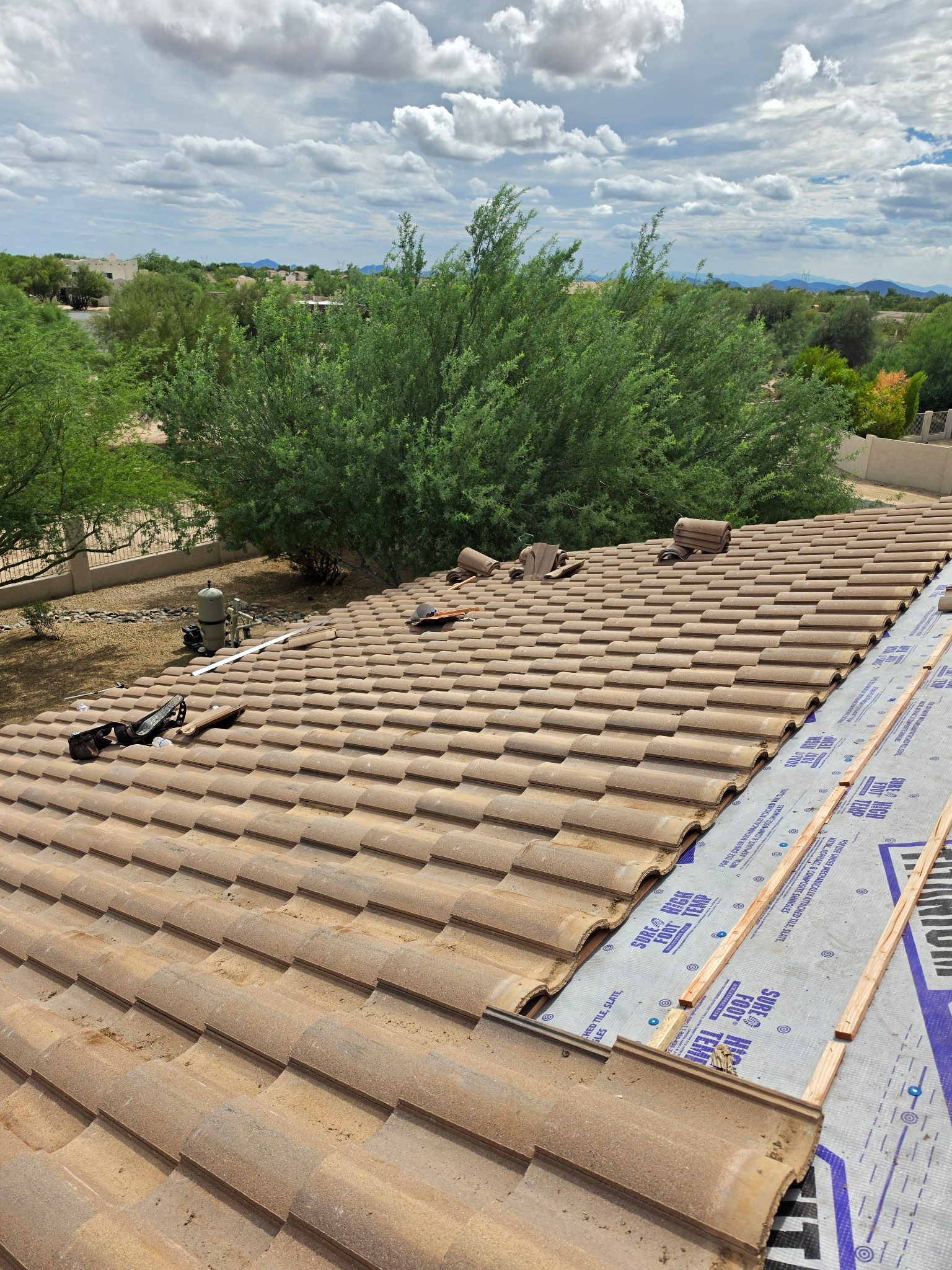 Tile reset beginning over the new roofing system in Phoenix Arizona