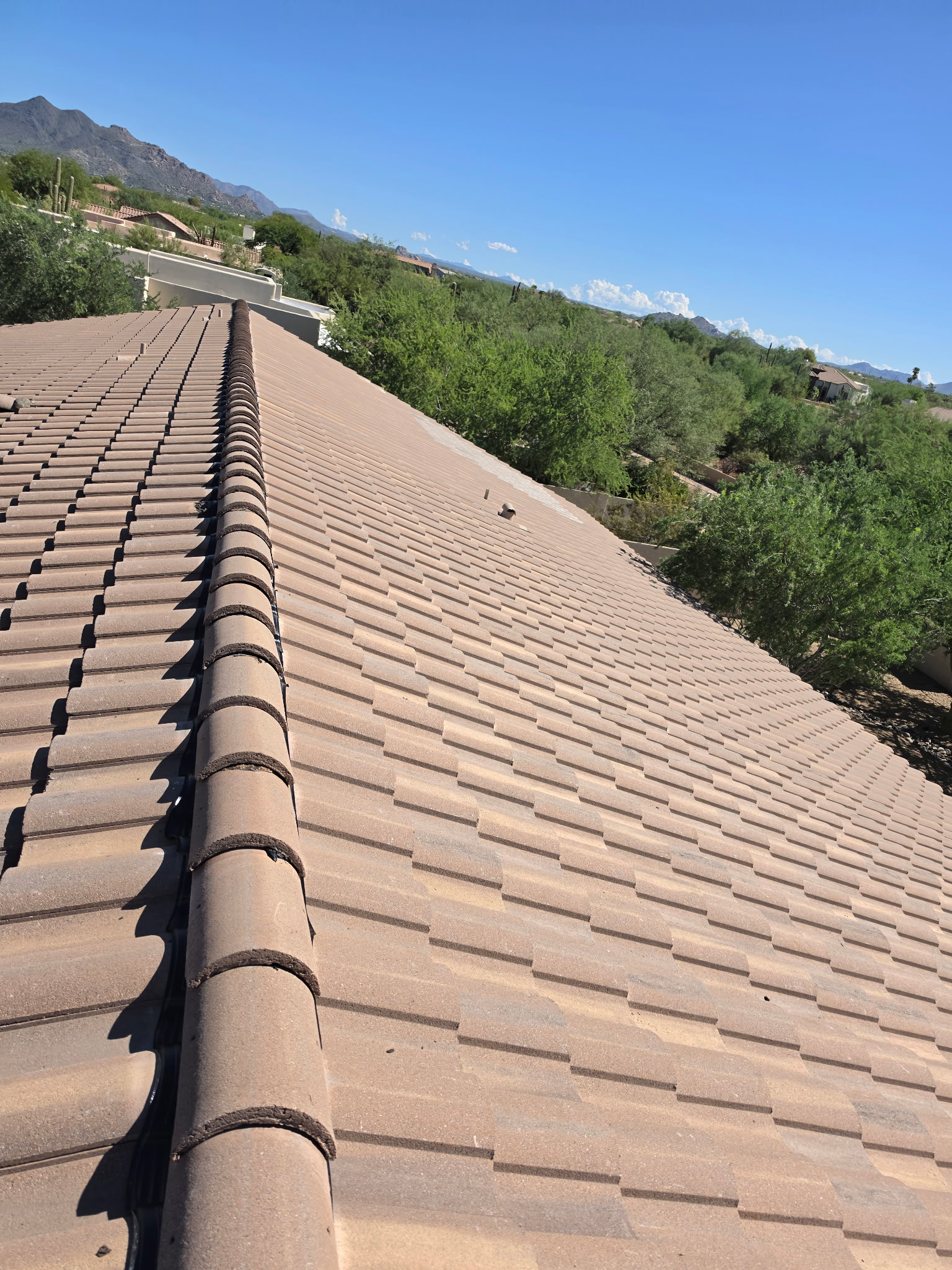 Completed tile roof ridge and main roof plane in Phoenix Arizona