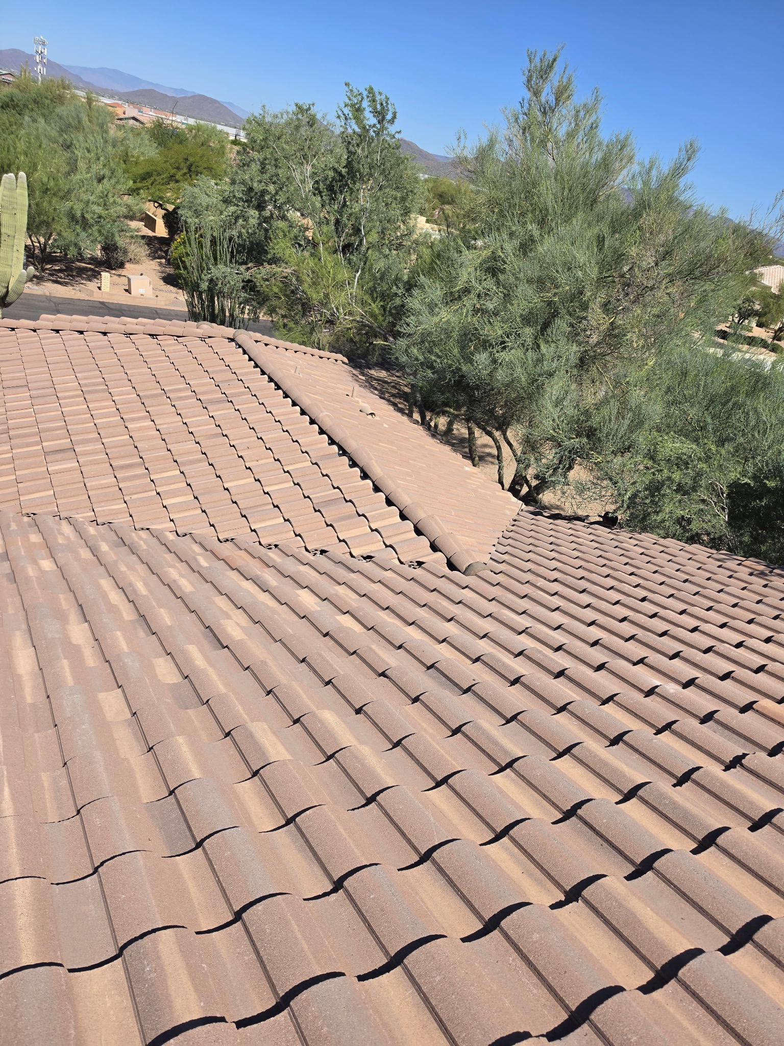 Finished tile installation across adjoining roof sections in Phoenix Arizona
