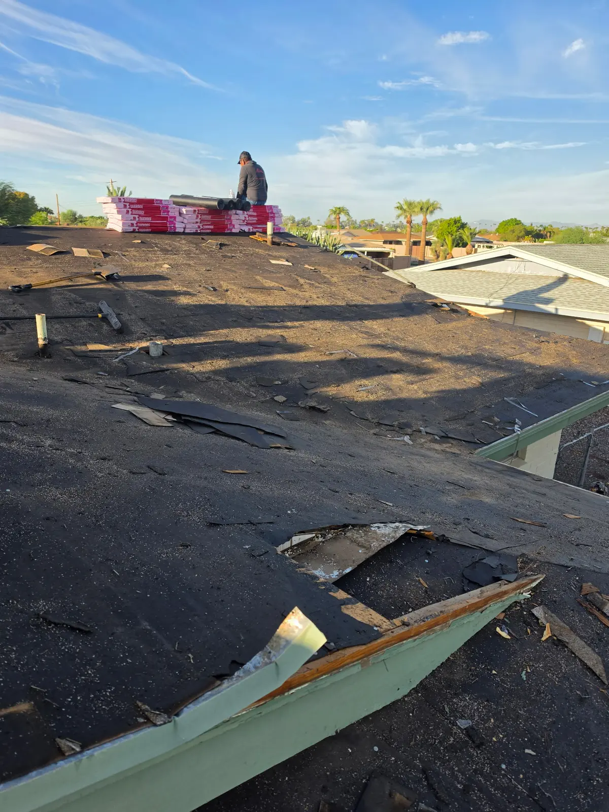 Exposed roof deck during shingle roof replacement in Mesa Arizona