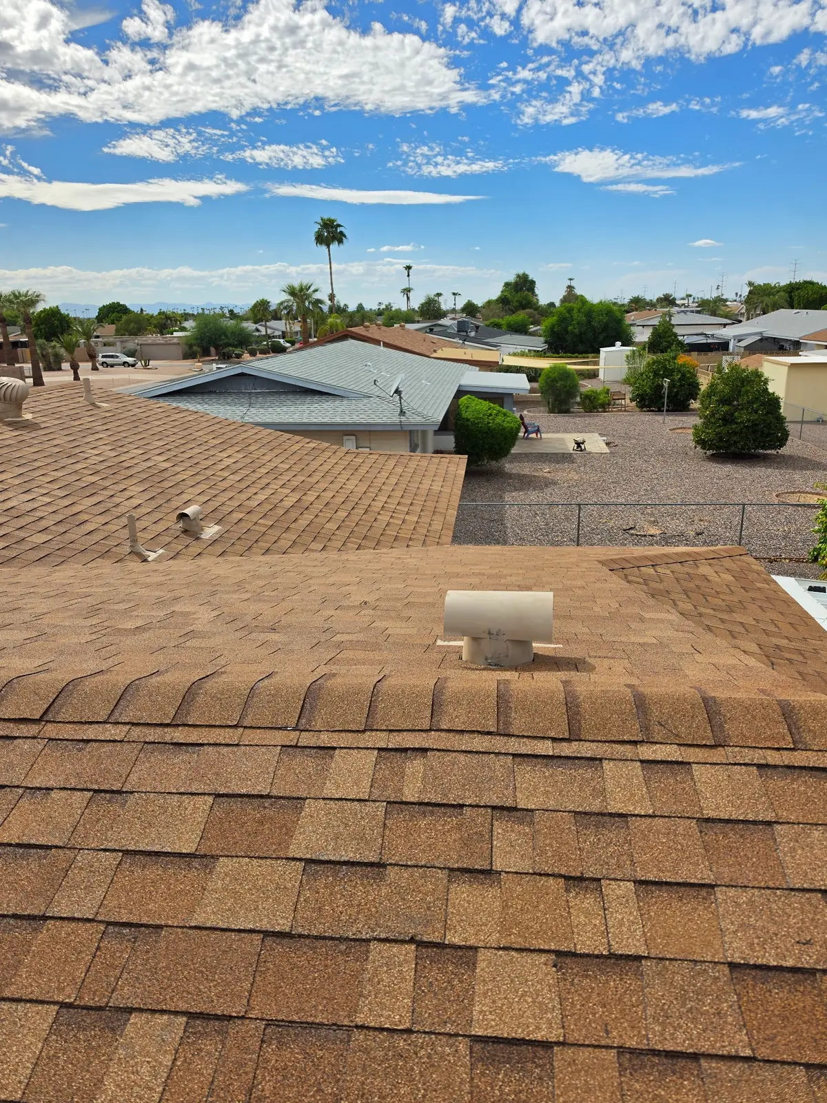 Completed shingle roof ridge cap detail in Mesa