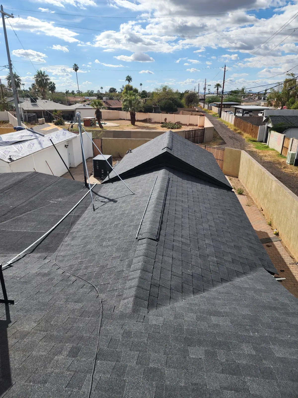 Wide view of completed architectural shingle roof in Arcadia