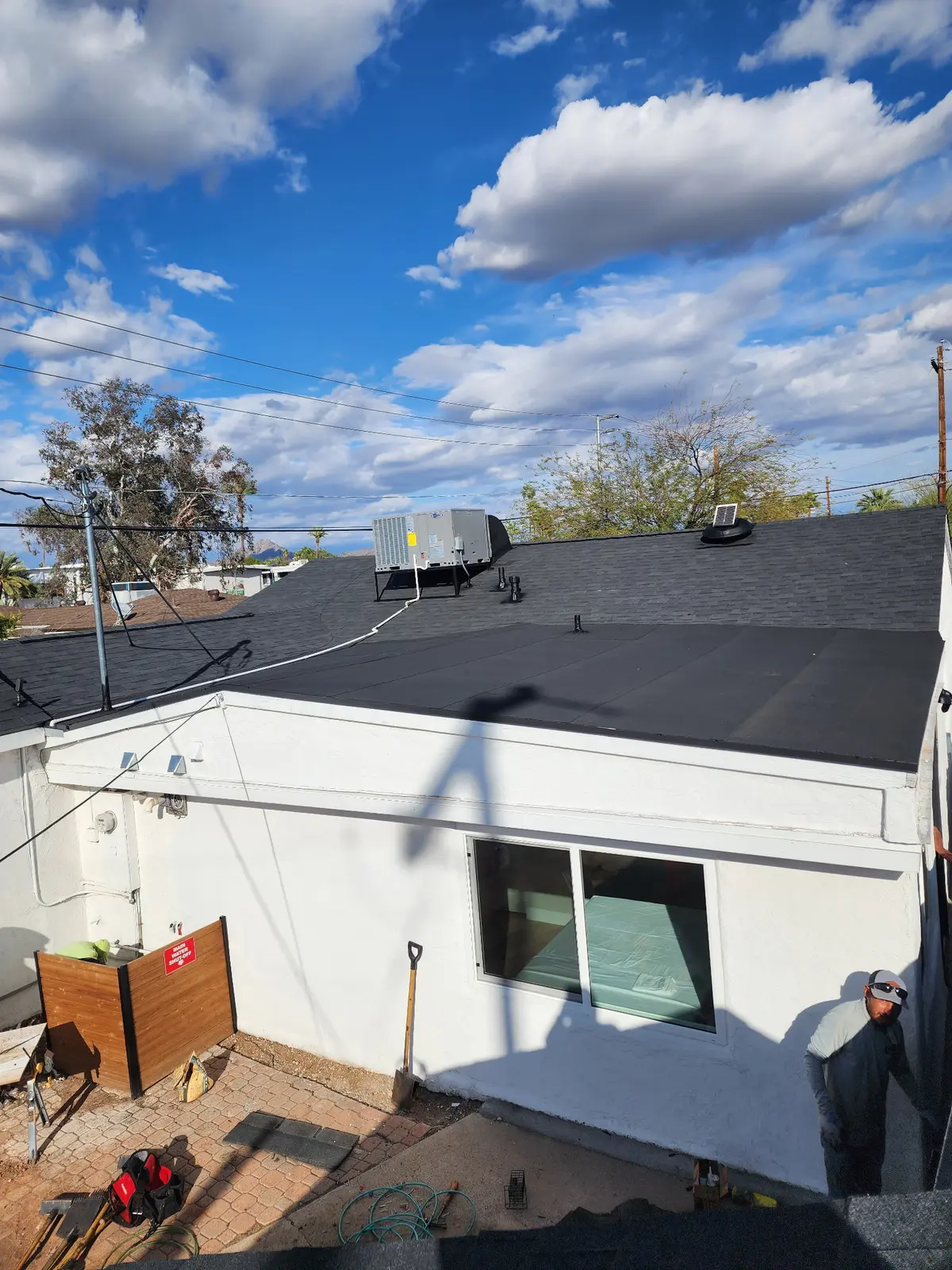 Finished transition between shingle and low-slope roof systems