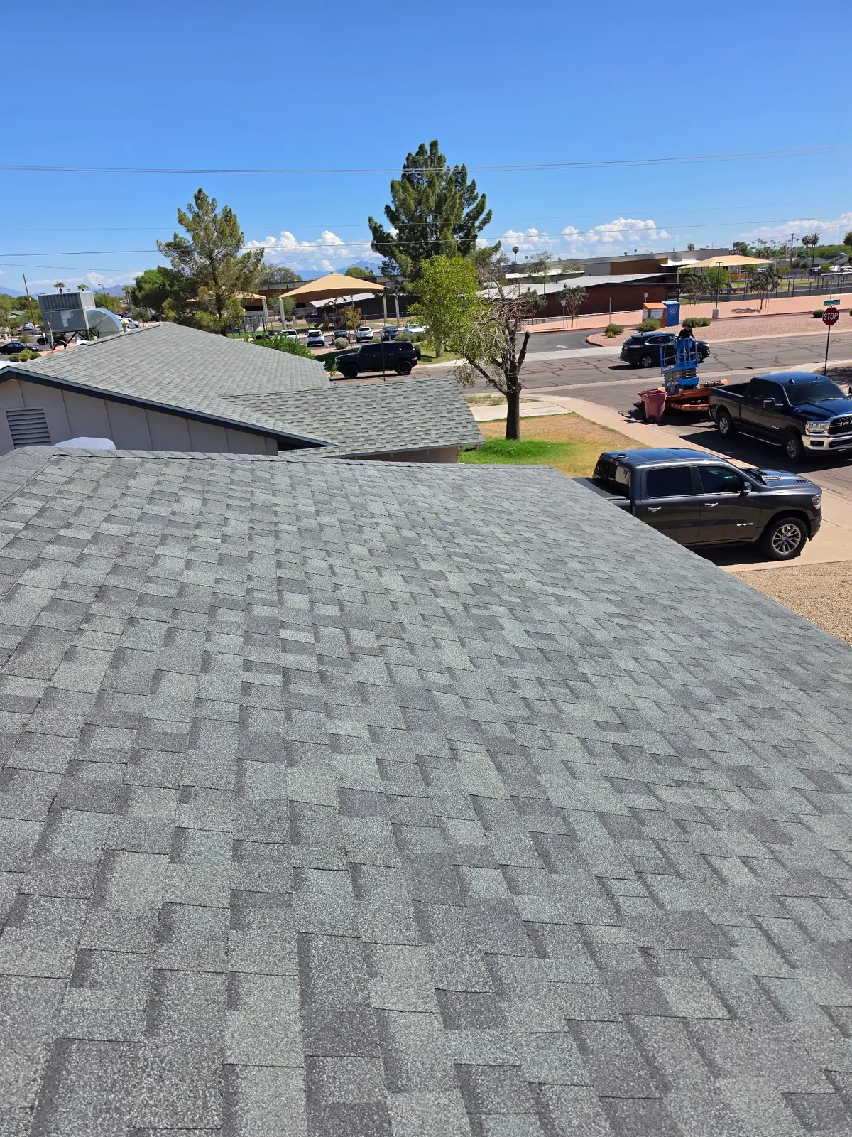 Completed gray architectural shingle roof field in Scottsdale Arizona