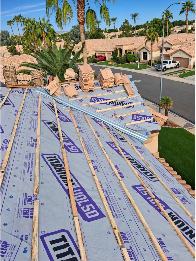 Underlayment and battens with tiles staged during a Chandler tile reroof