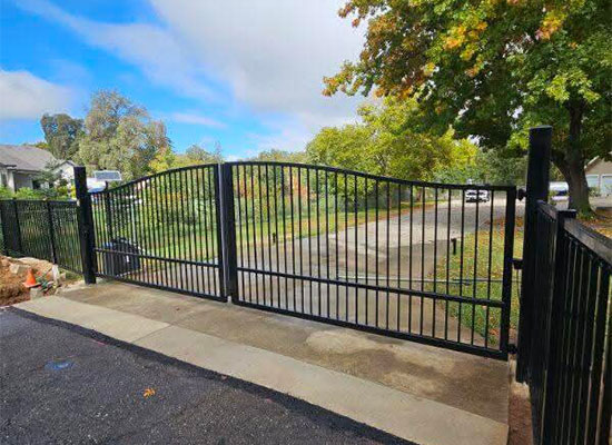 A double iron gate with a gate operator.