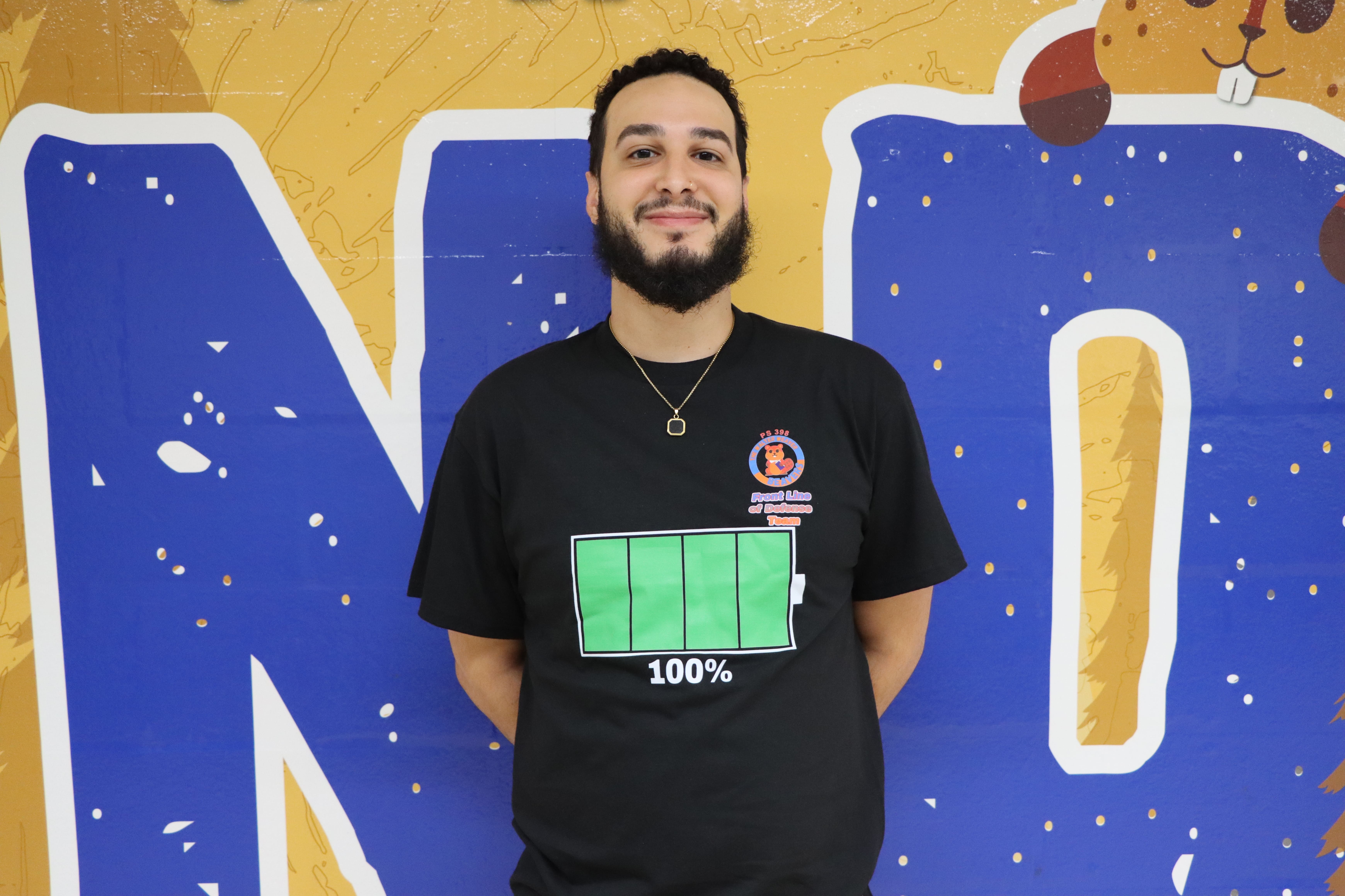 Staff member Noel Diaz poses for portrait