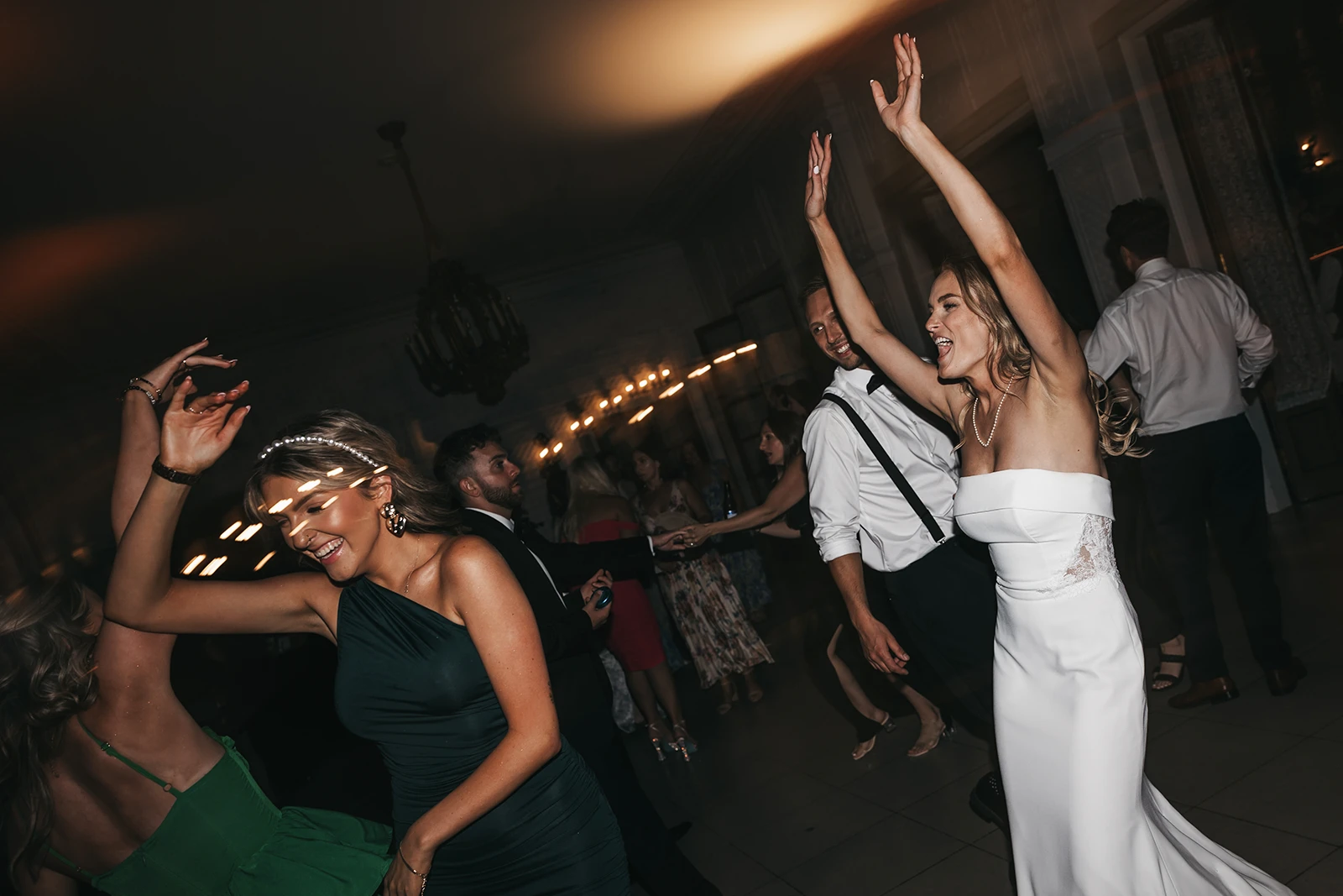 A bride running on to the dancefloor.