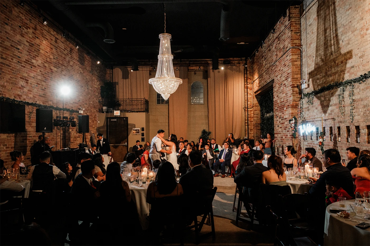 A bride and groom dancing together at their wedding reception.