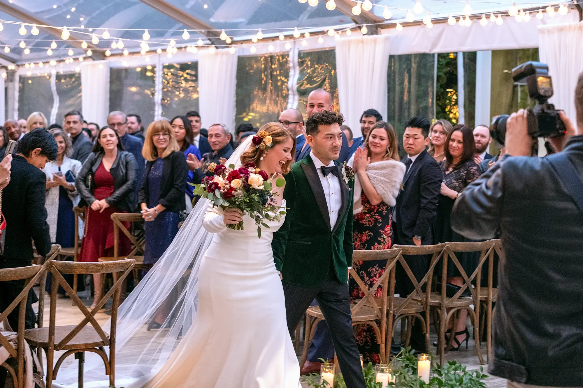 A couple walking down the aisle at their wedding.