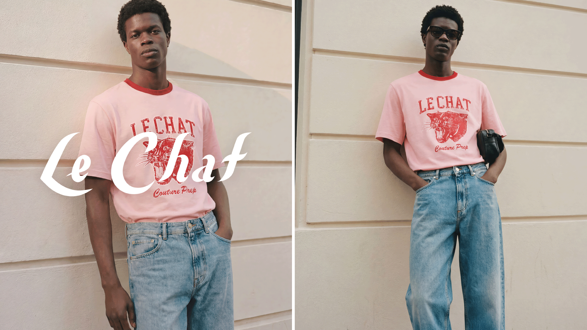 Man wearing pink Le Chat Couture Prep t-shirt with red graphic and light blue jeans by a beige wall.