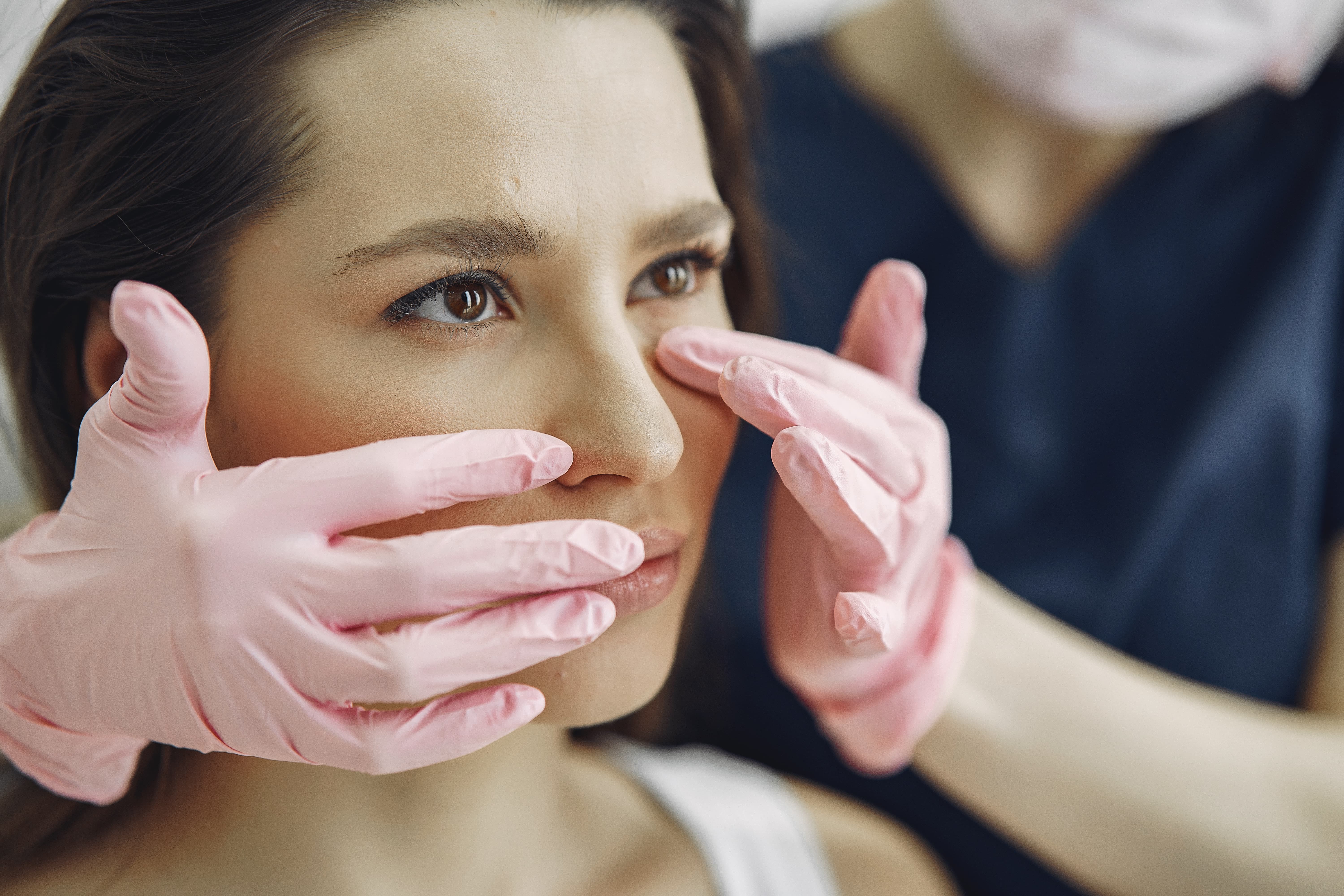 Patient consulting a dermatologist for under-eye dark circles and puffiness treatment.
