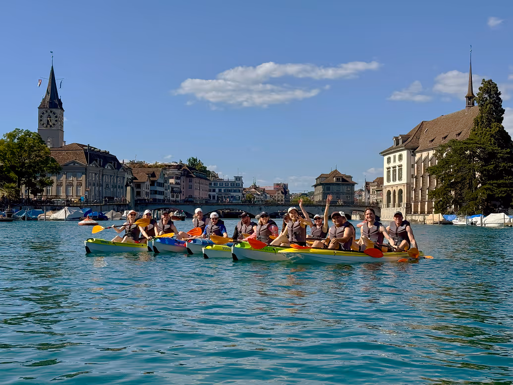 Group of people kayaking together on lake Zurich