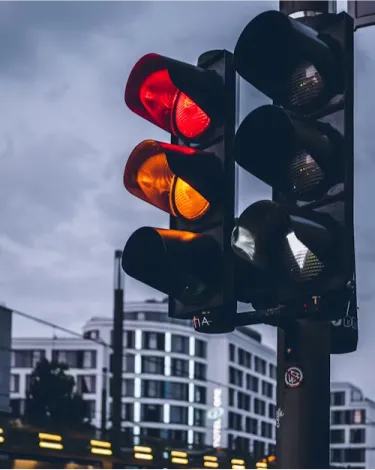 Traffic light with red and yellow illuminated. AI Agents concept.