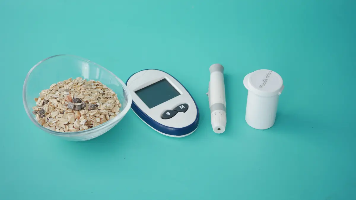 Oatmeal next to a diabetes measuring instruments
