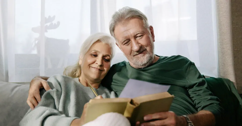 senior couple reading book