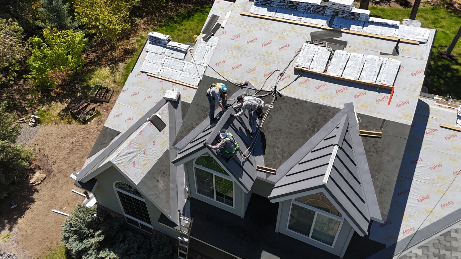 Scott's Roofing team installing roof