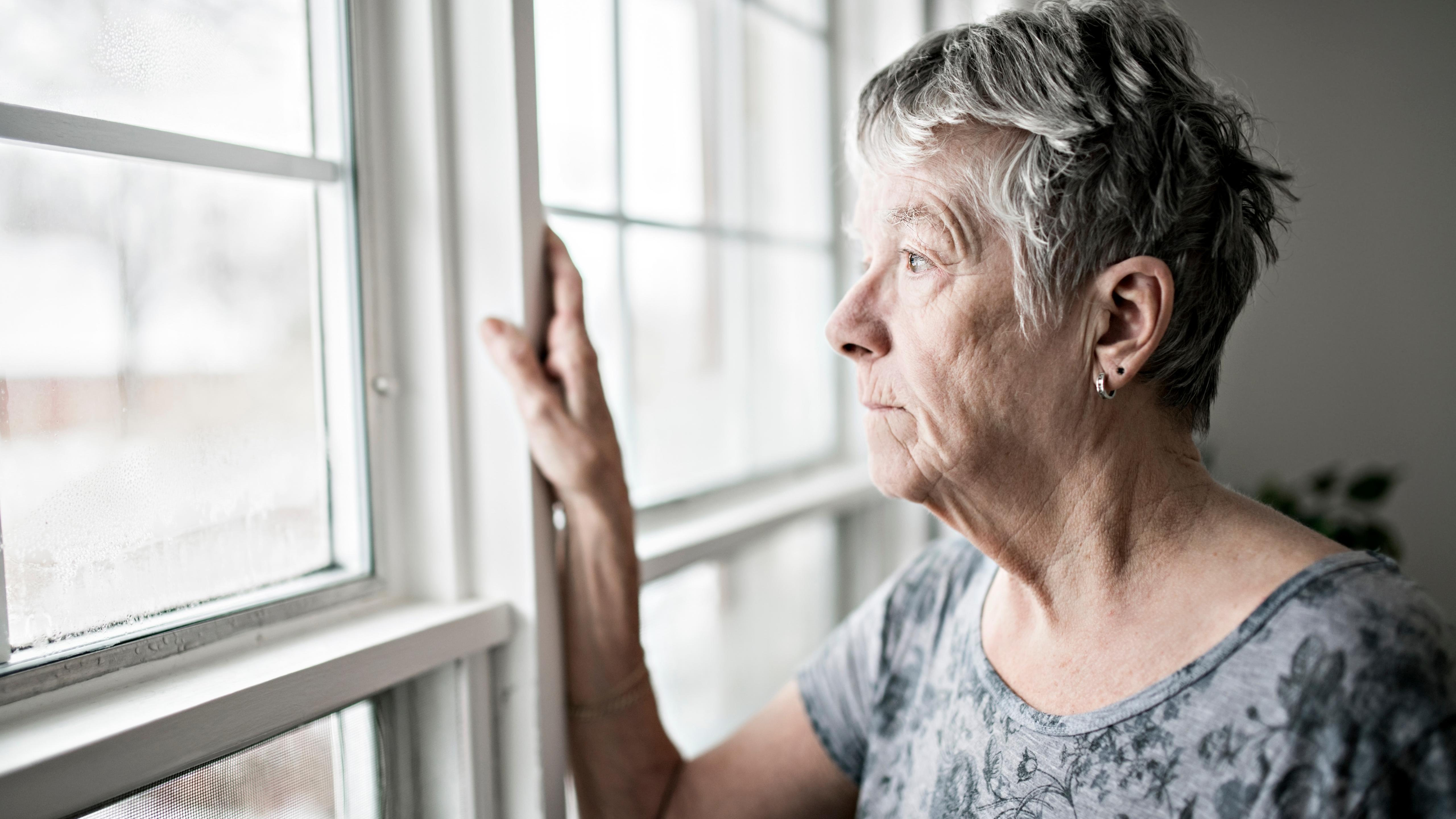 Two men sitting at a table outside playing chess - Dementia prevention activities from the psychologists at Pacific Coast Psychology