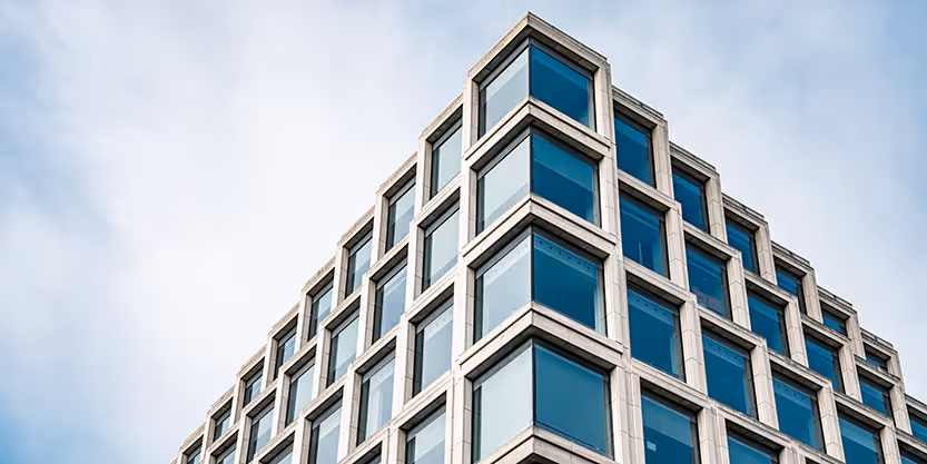 A person uses a 360-degree camera to create a 3D model of a space.
