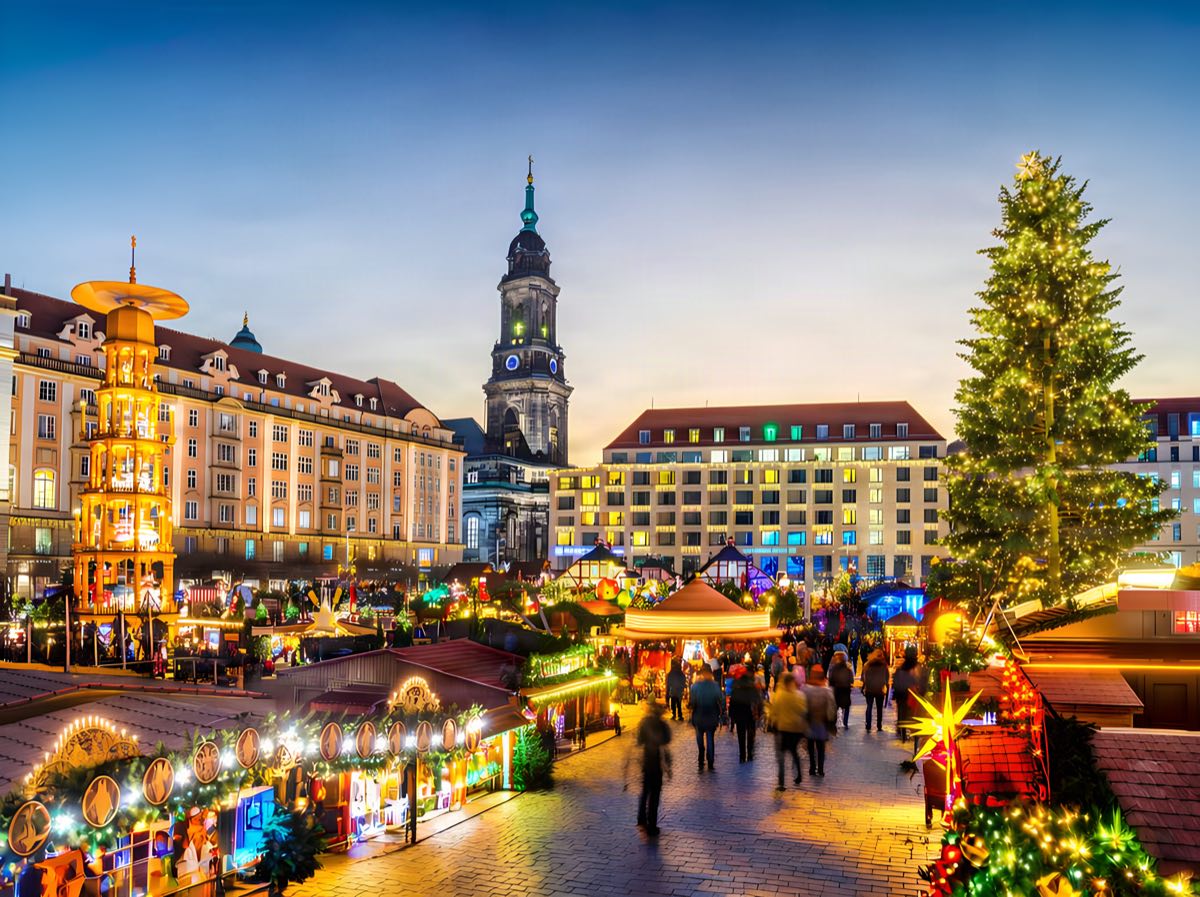Christmas pyramid and decorated stalls at the Striezelmarkt in Dresden's Old Town.