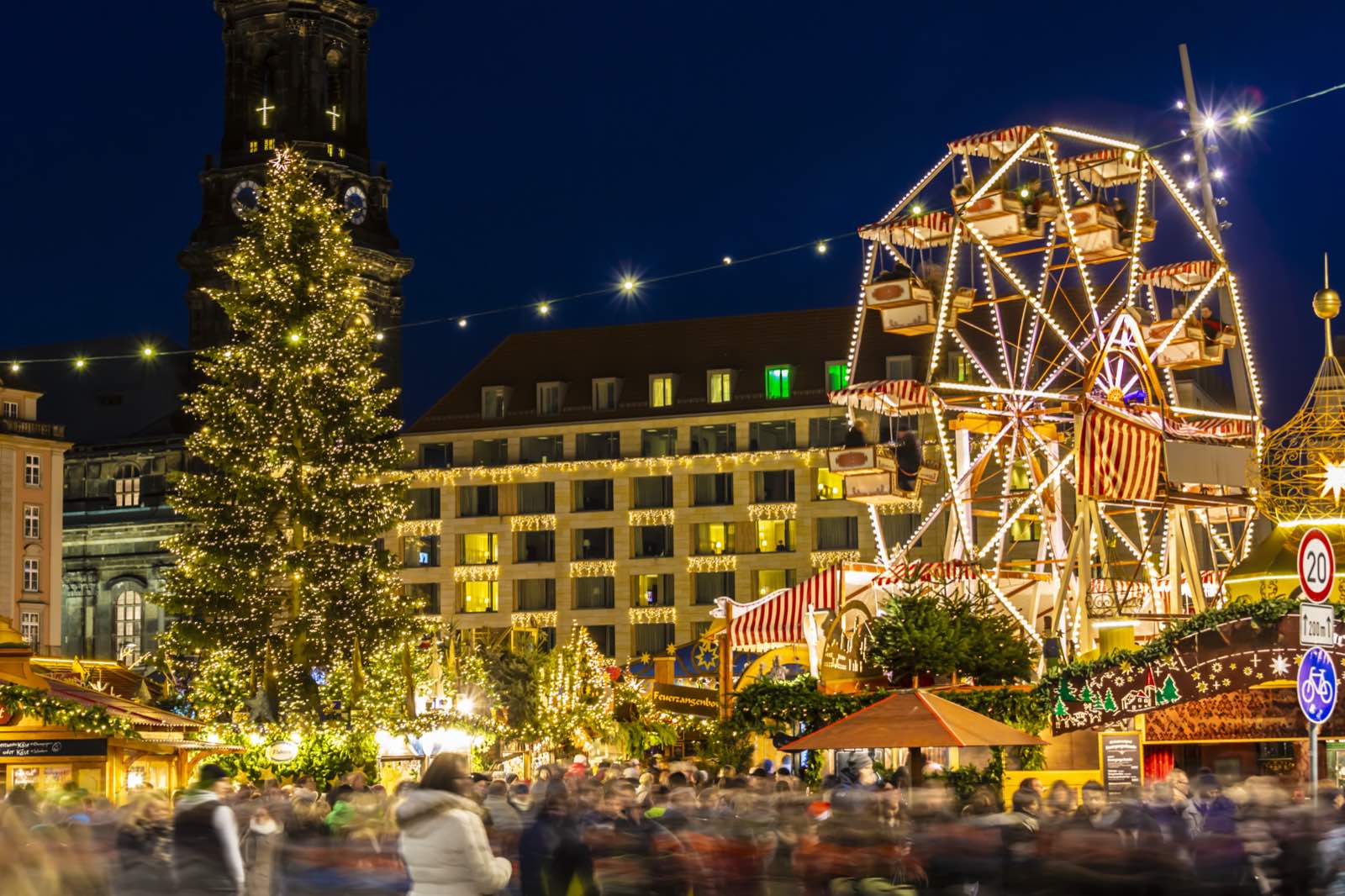 Ferris wheel and Christmas tree at the Dresden Christmas market at night.