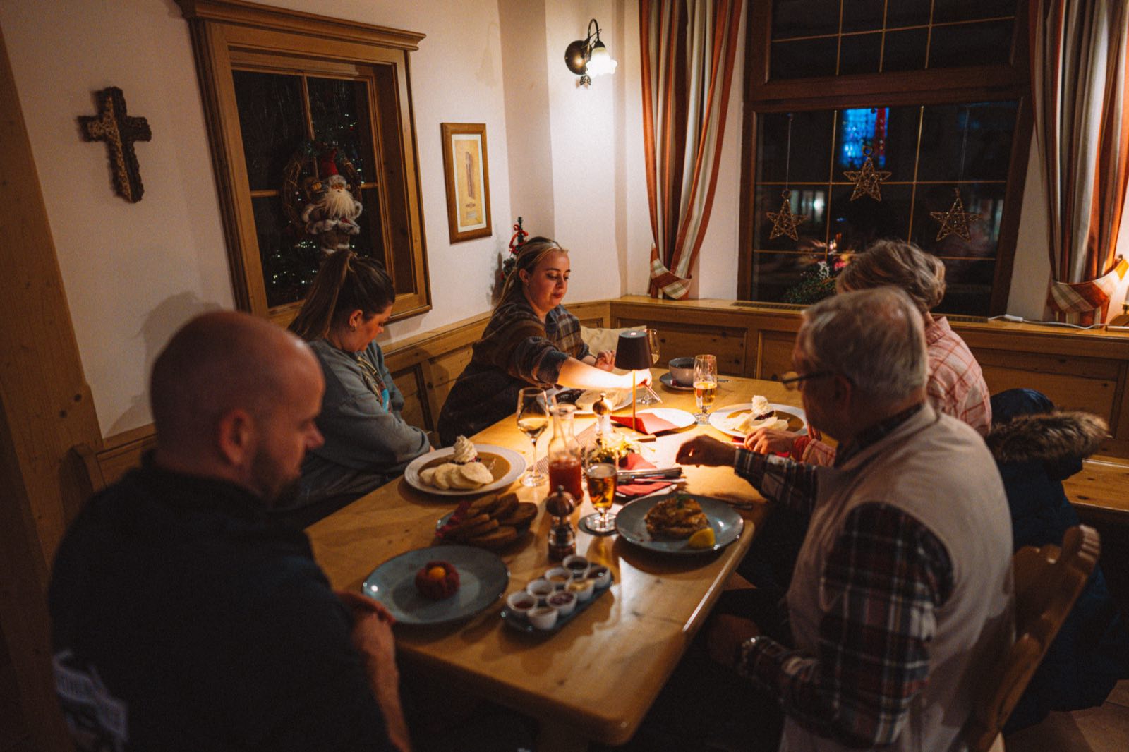Guests enjoying lunch in a cozy traditional restaurant in winter.
