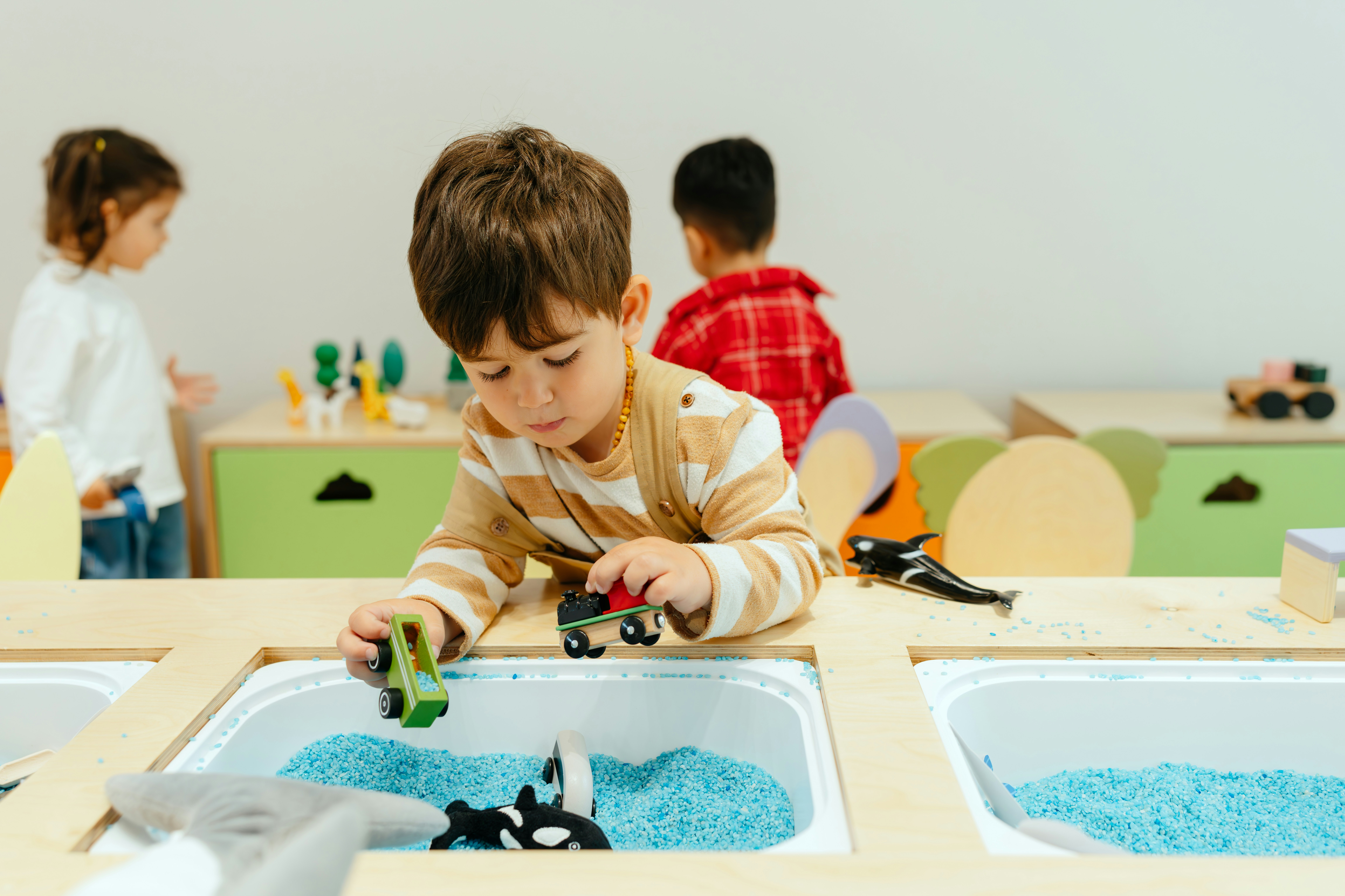 A boy playing with sensory tray