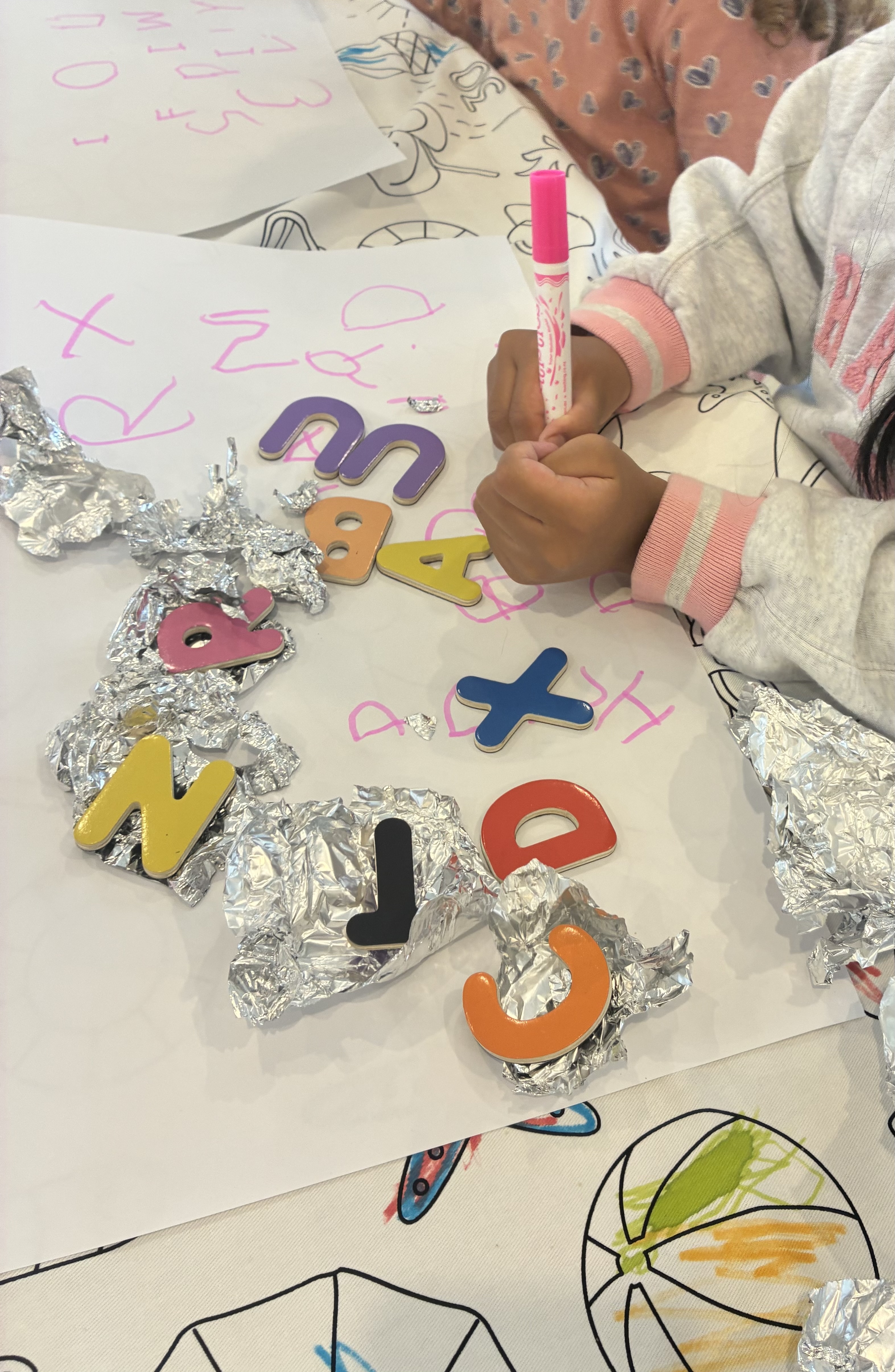 A child writing a letter during therapy session