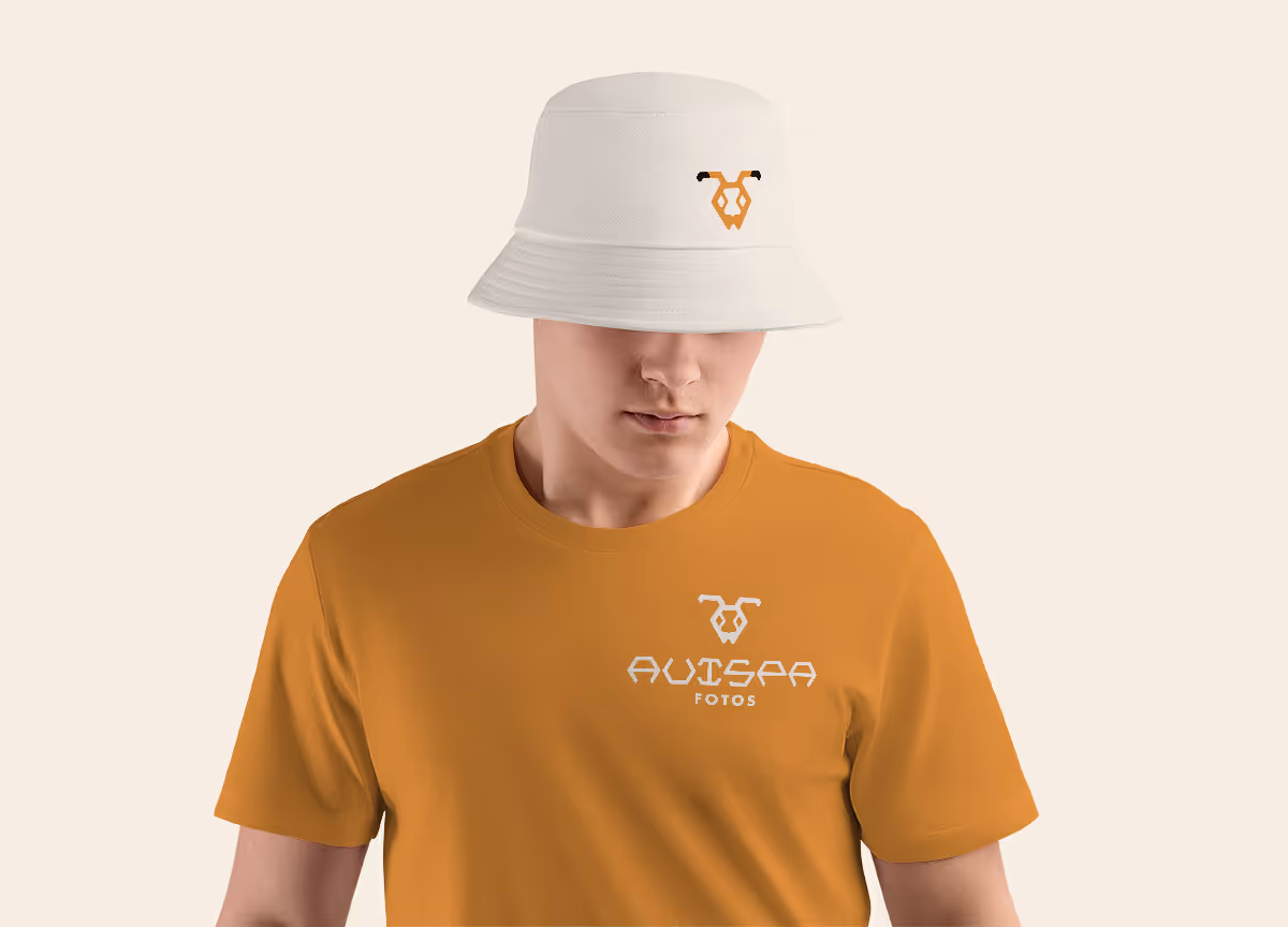 Male wearing orange t-shirt and white bucket hat with Avispa Fotos logo on them