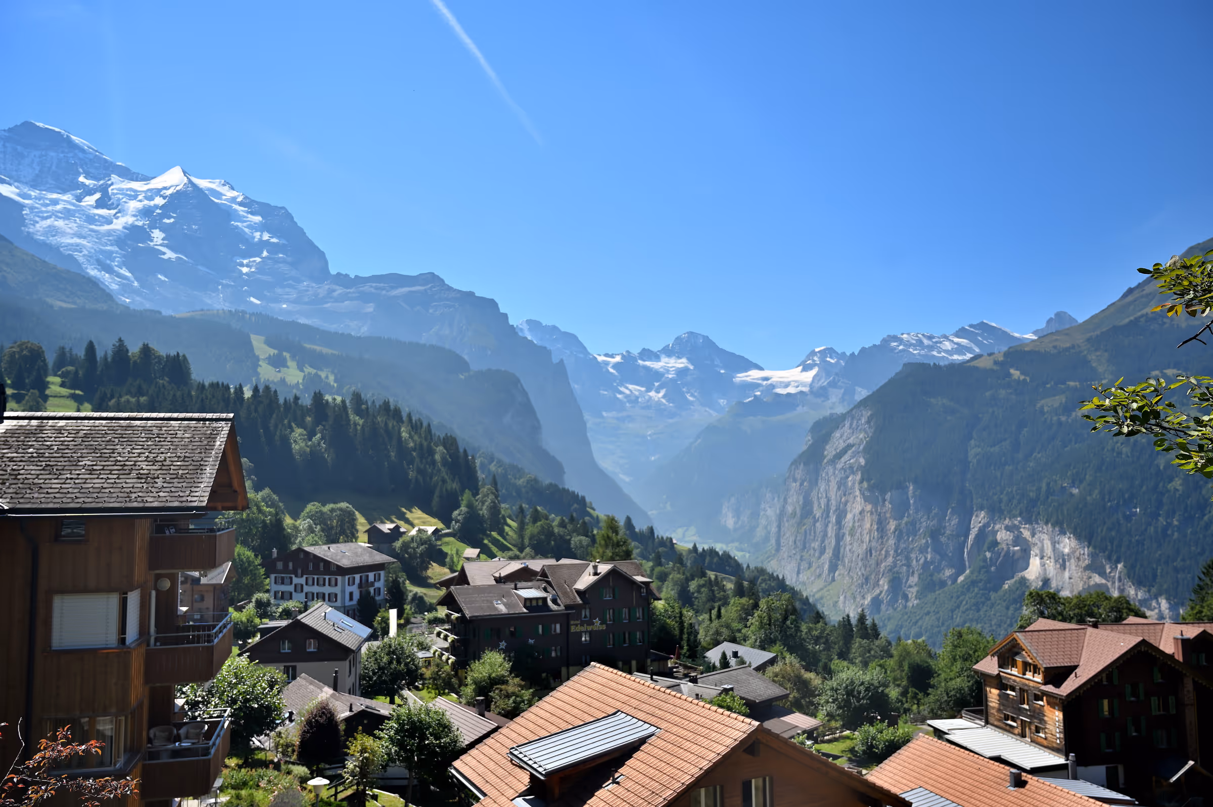 View from the mountain train ascending from Lauterbrunnen to Wengen, overlooking the Lauterbrunnen Valley and alpine villages.