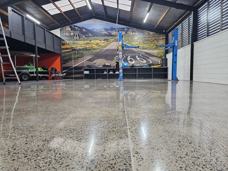 Polished concrete man cave floor with Route 66 mural in Mt Wellington