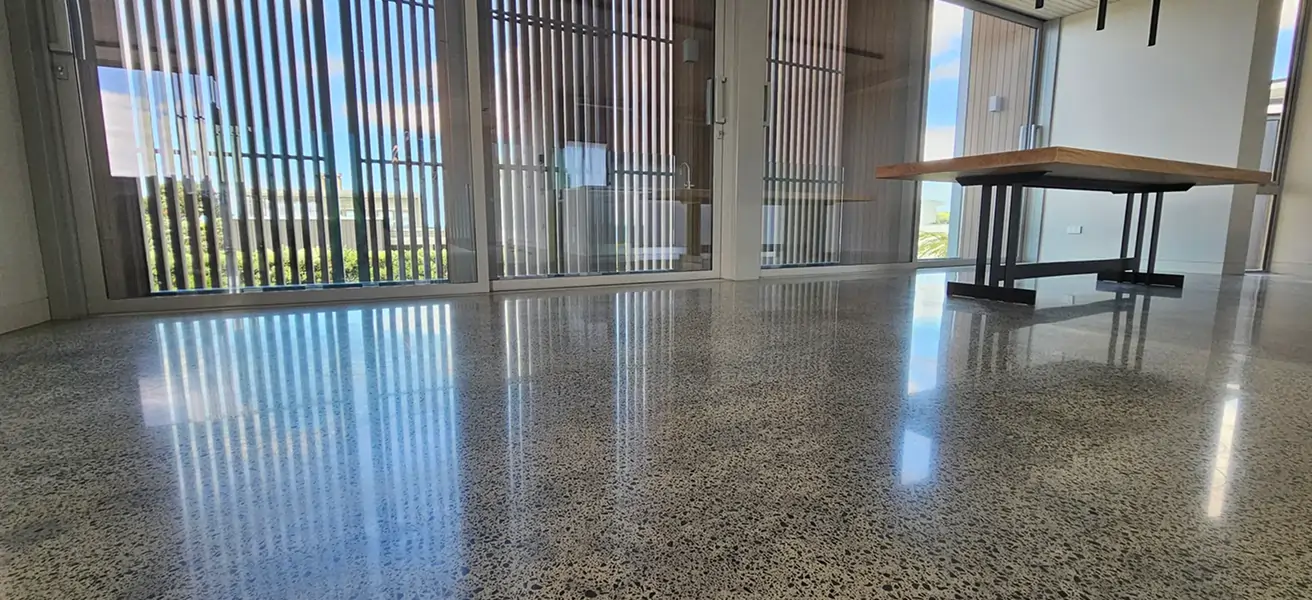 Diamond Shine Concrete polishing in progress on a concrete floor in an Auckland new build with cityscape views