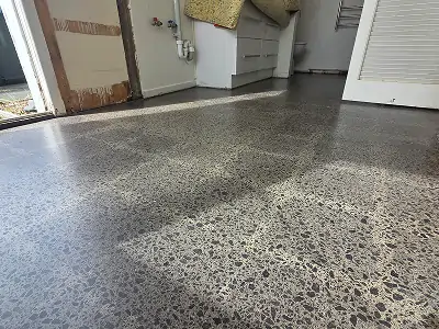 Diamond Shine Concrete polished concrete open-plan living floor with garden views in Auckland home refurbishment